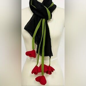 Long stylish lightweight scarf with flower detail at the ends.